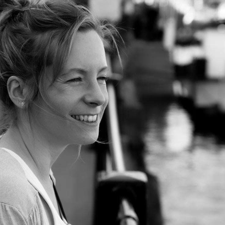 Alex Rivera, Lead Design Curator at Balanced Thinking Space, reviewing corporate floral arrangements